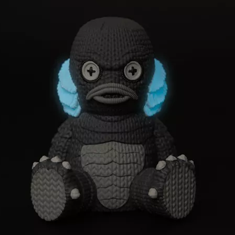 Creature from the Black Lagoon Glow in the Dark Vinyl Figure handmade by Handmade by Robots glowing in blue light